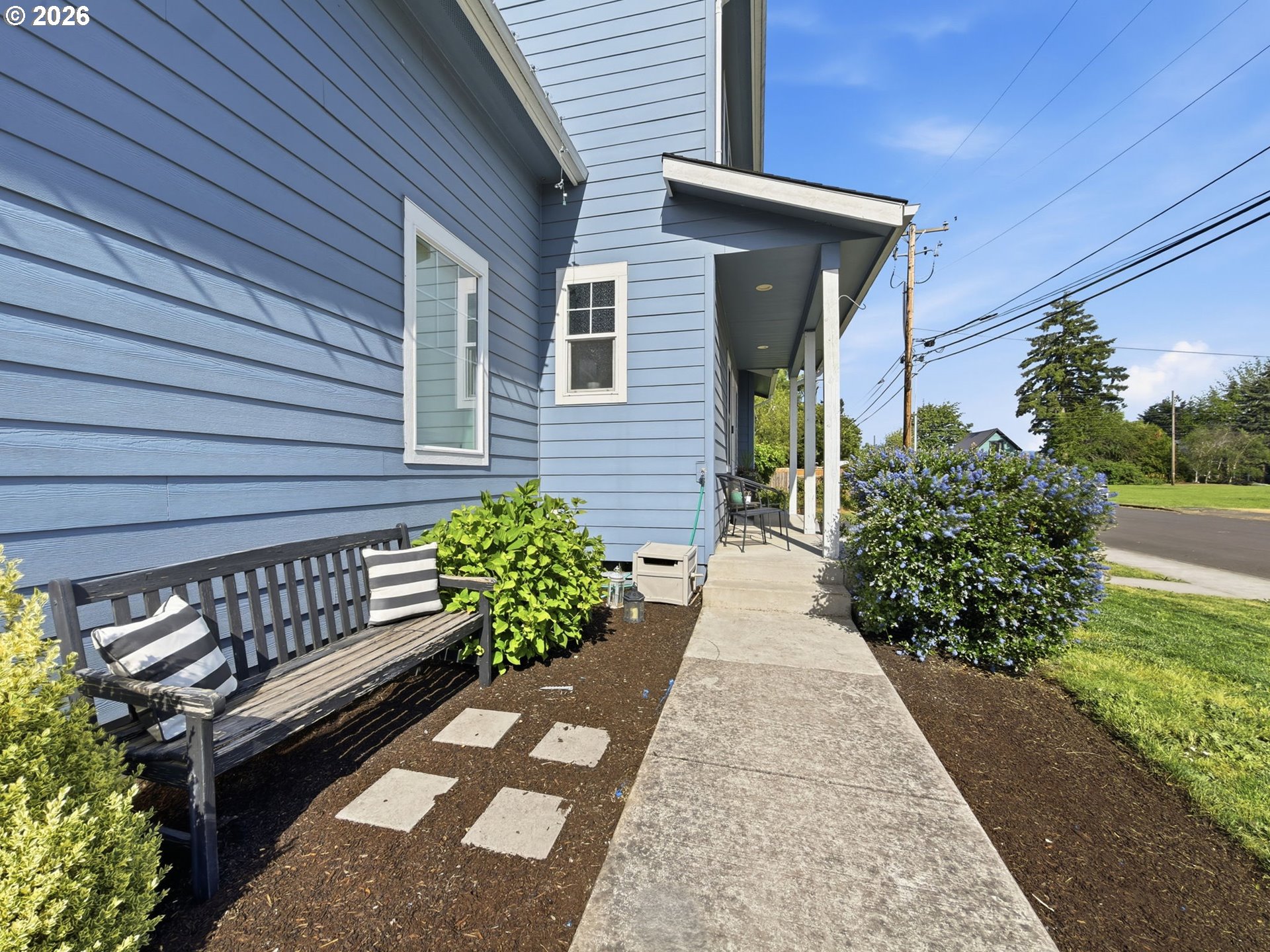 1310 Elm Street Junction City, OR 97448 - Photo 4 of 39 a view of a backyard with flowers