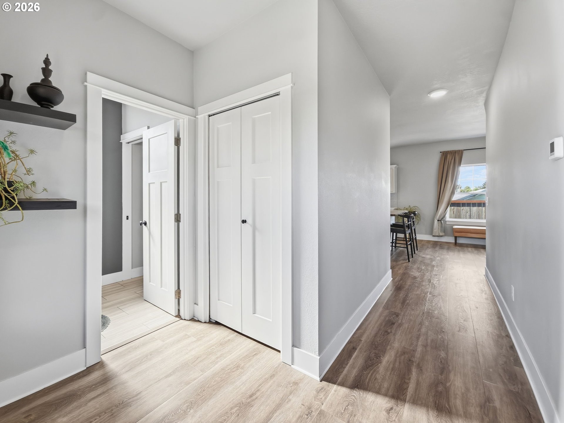 1310 Elm Street Junction City, OR 97448 - Photo 8 of 39 a view of a hallway with wooden floor and closet