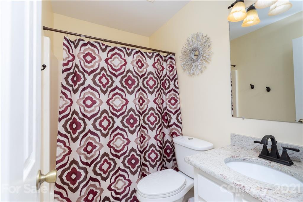762 State Rd S-46-1086 Clover, SC 29710 - Photo 11 of 34 a bathroom with a sink mirror vanity and toilet