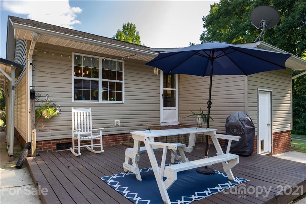762 State Rd S-46-1086 Clover, SC 29710 - Photo 21 of 34 an outdoor space with furniture and umbrella