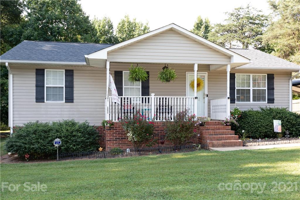 762 State Rd S-46-1086 Clover, SC 29710 - Photo 31 of 34 a front view of a house with garden