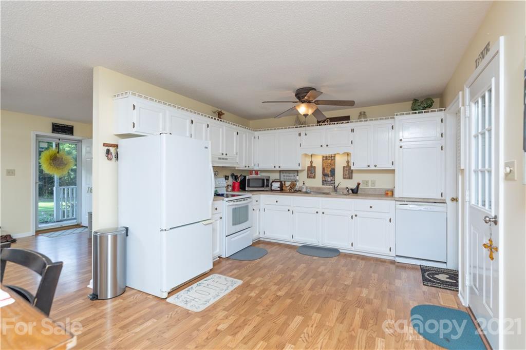 762 State Rd S-46-1086 Clover, SC 29710 - Photo 6 of 34 a kitchen with white cabinets and white appliances