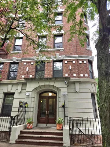 a view of a building with a tree