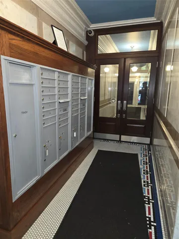 a view of a porch with wooden floor and windows