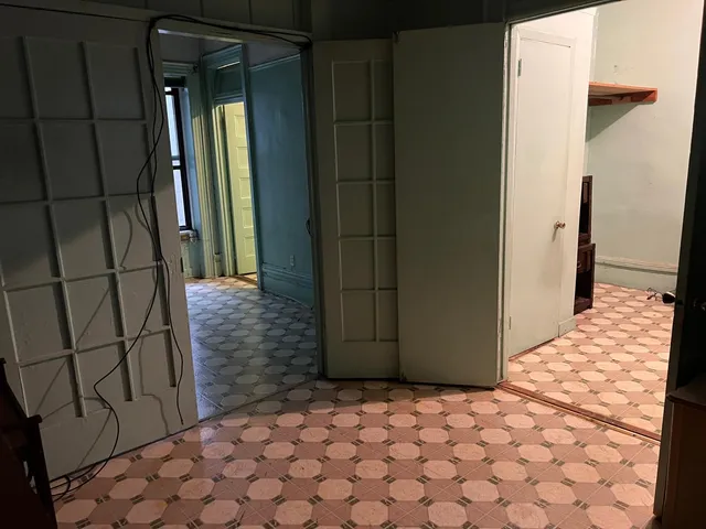 a room with a dresser and a mirror