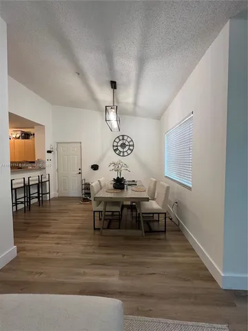 a view of a living room and dining room