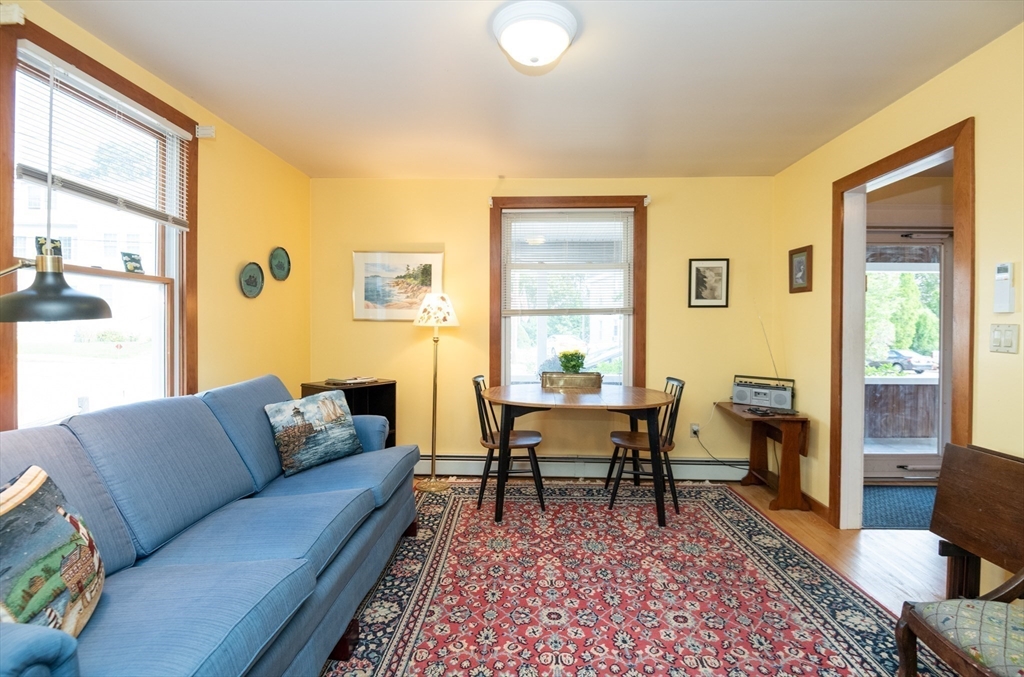 18 Lafayette Road Ipswich, MA 01938 - Photo 11 of 42 a living room with furniture wooden floor and a table