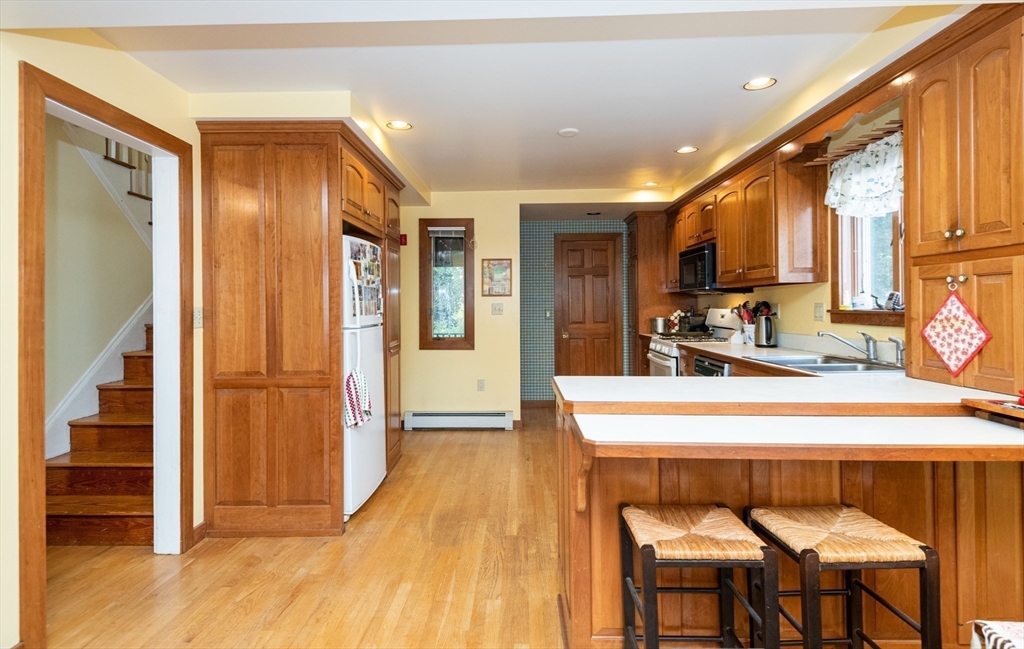 18 Lafayette Road Ipswich, MA 01938 - Photo 12 of 42 a large kitchen with a table and chairs
