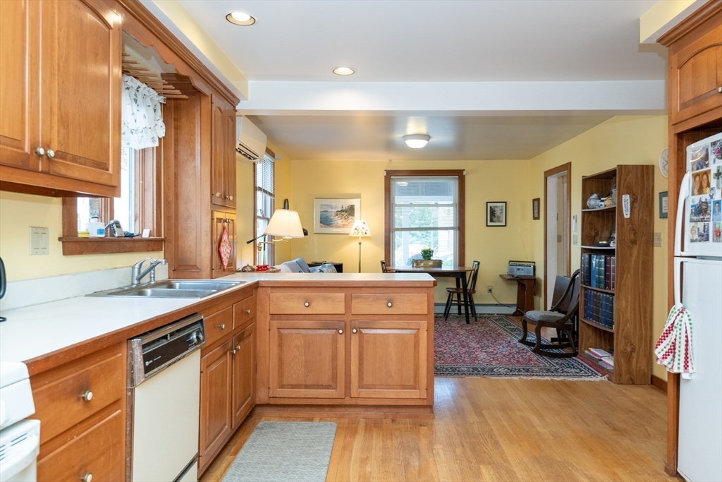 18 Lafayette Road Ipswich, MA 01938 - Photo 14 of 42 a kitchen with a sink appliances cabinets and a large window