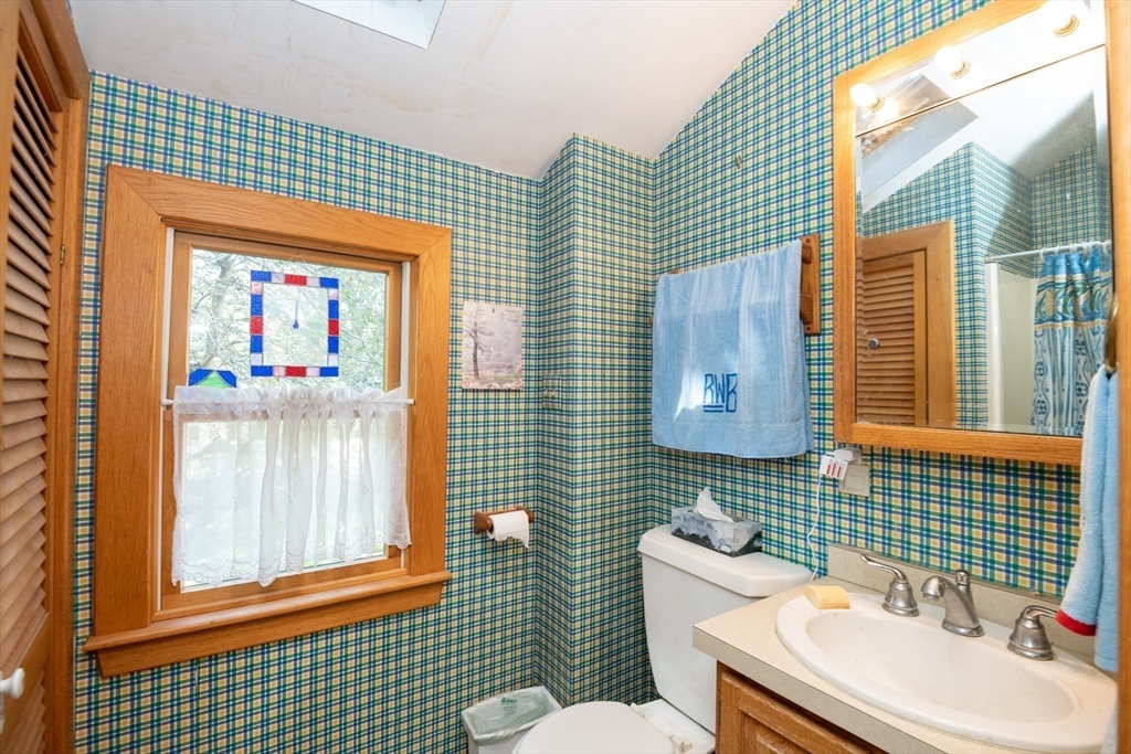 18 Lafayette Road Ipswich, MA 01938 - Photo 15 of 42 a bathroom with a sink toilet and window
