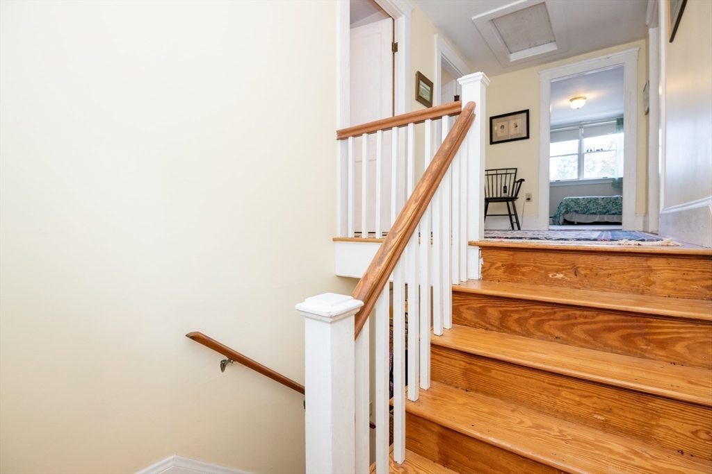 18 Lafayette Road Ipswich, MA 01938 - Photo 20 of 42 a view of staircase with lots of frames on wall and windows