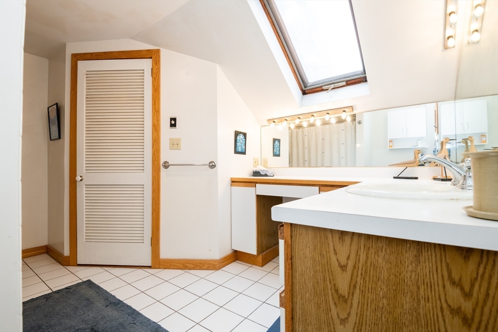 18 Lafayette Road Ipswich, MA 01938 - Photo 22 of 42 a bathroom with a sink and a mirror