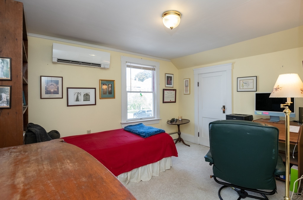 18 Lafayette Road Ipswich, MA 01938 - Photo 23 of 42 a bedroom with a bed and furniture