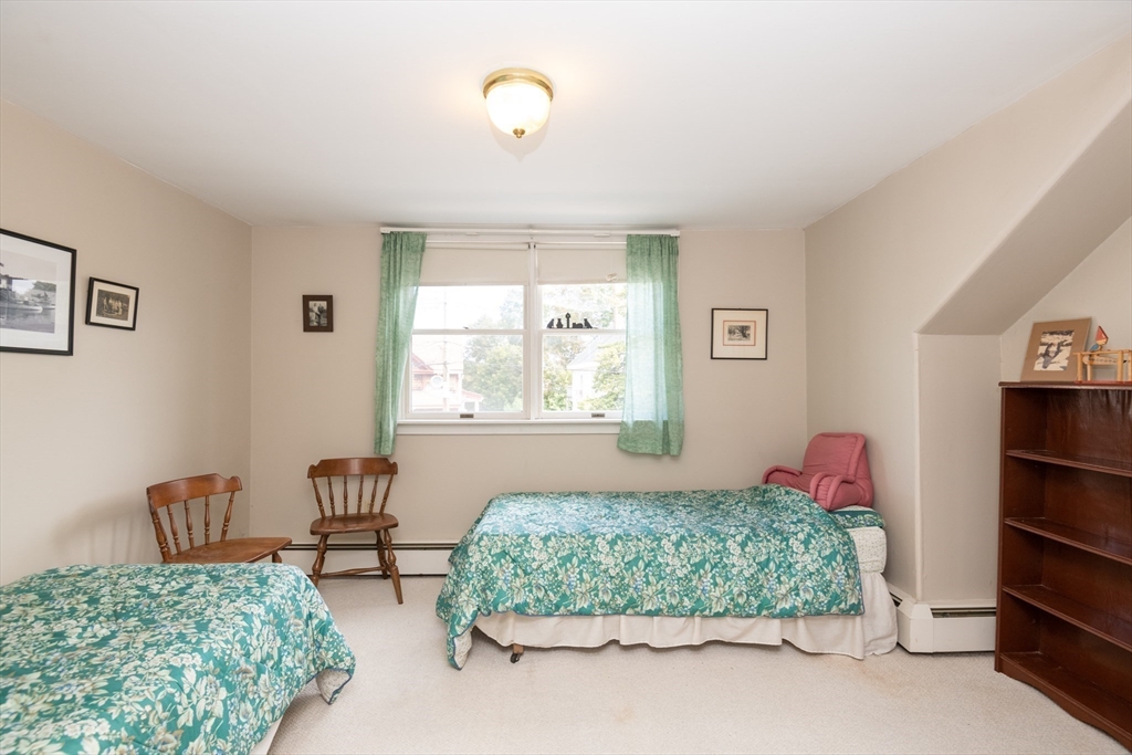 18 Lafayette Road Ipswich, MA 01938 - Photo 25 of 42 a bedroom with a bed and a window