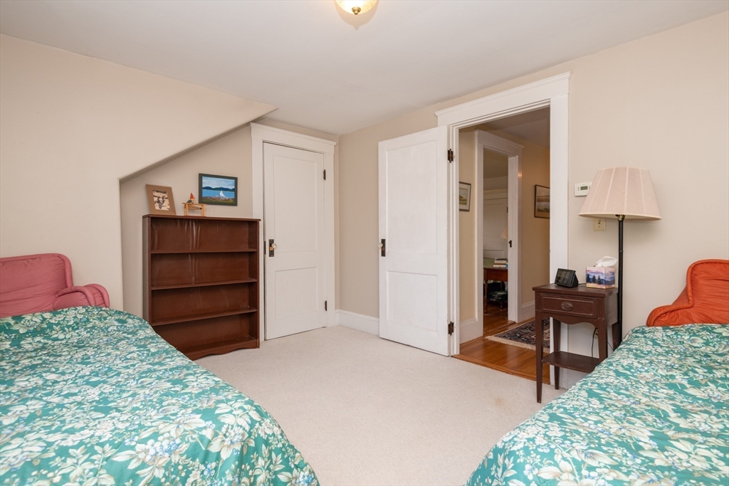 18 Lafayette Road Ipswich, MA 01938 - Photo 26 of 42 a bedroom with a bed and furniture