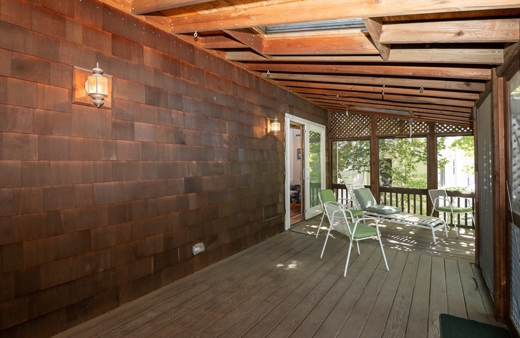 18 Lafayette Road Ipswich, MA 01938 - Photo 33 of 42 a view of a patio with a table chairs and wooden floor
