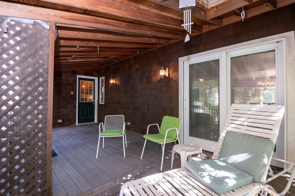 18 Lafayette Road Ipswich, MA 01938 - Photo 35 of 42 a patio with glass top table and chairs
