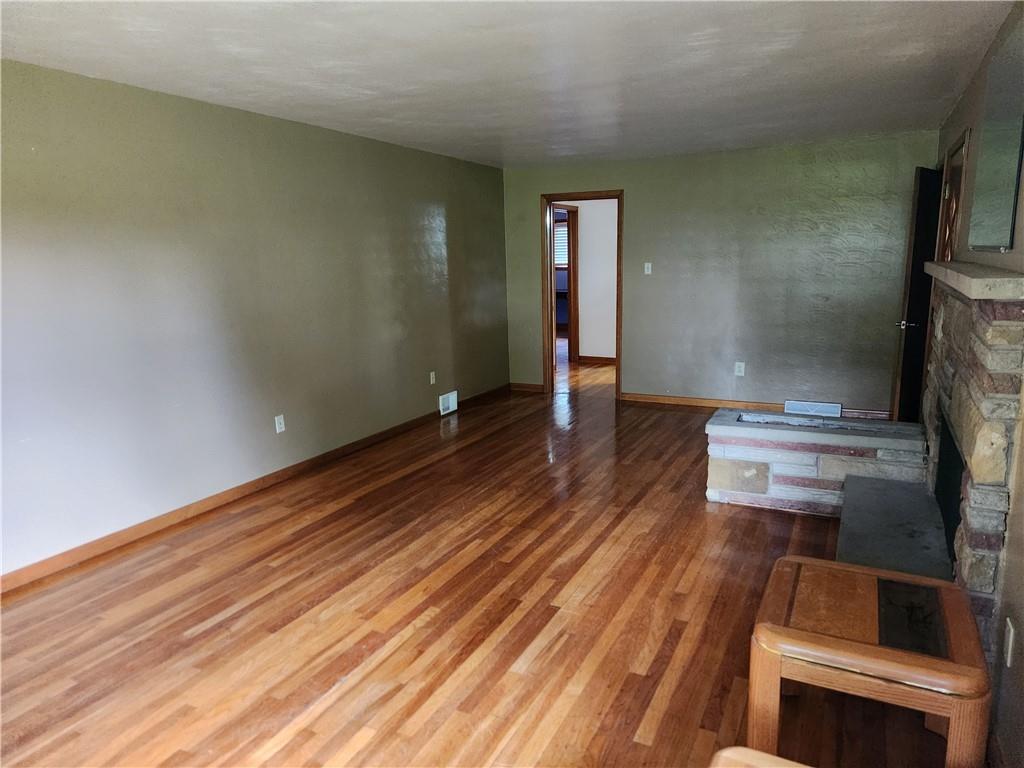 102 September Drive Butler, PA 16002 - Photo 14 of 26 a view of a room with wooden floor and staircase
