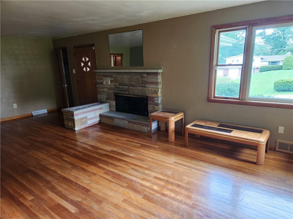 102 September Drive Butler, PA 16002 - Photo 16 of 26 a living room with furniture and a fireplace