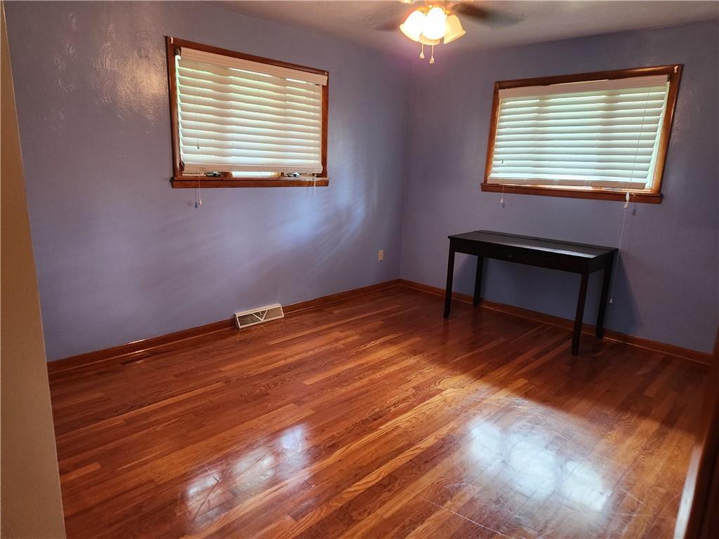 102 September Drive Butler, PA 16002 - Photo 18 of 26 a view of a room with wooden floor and a window