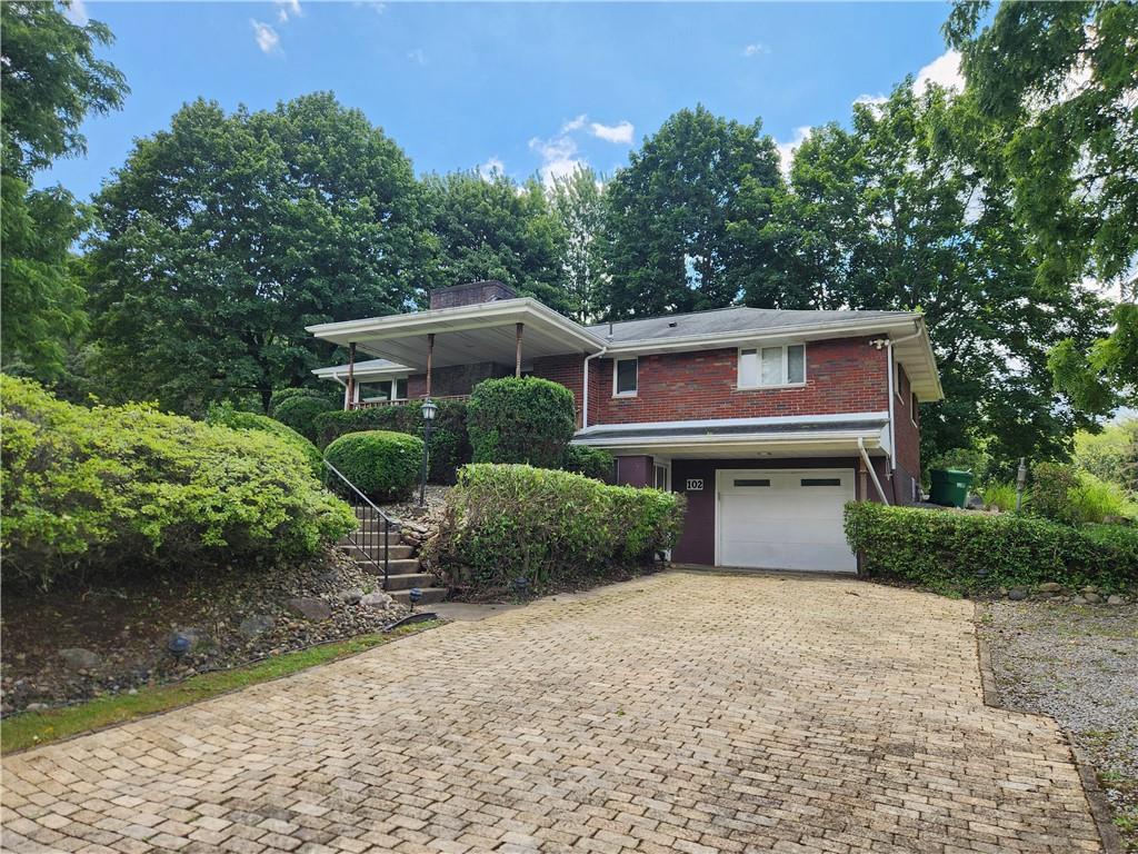 102 September Drive Butler, PA 16002 - Photo 2 of 26 a front view of a house with a yard
