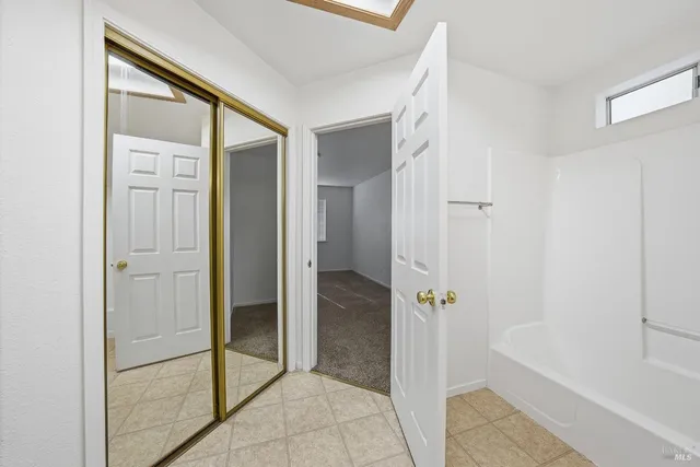 a bathroom with a tub and shower