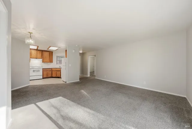 a view of a big room with wooden cabinet and a fireplace
