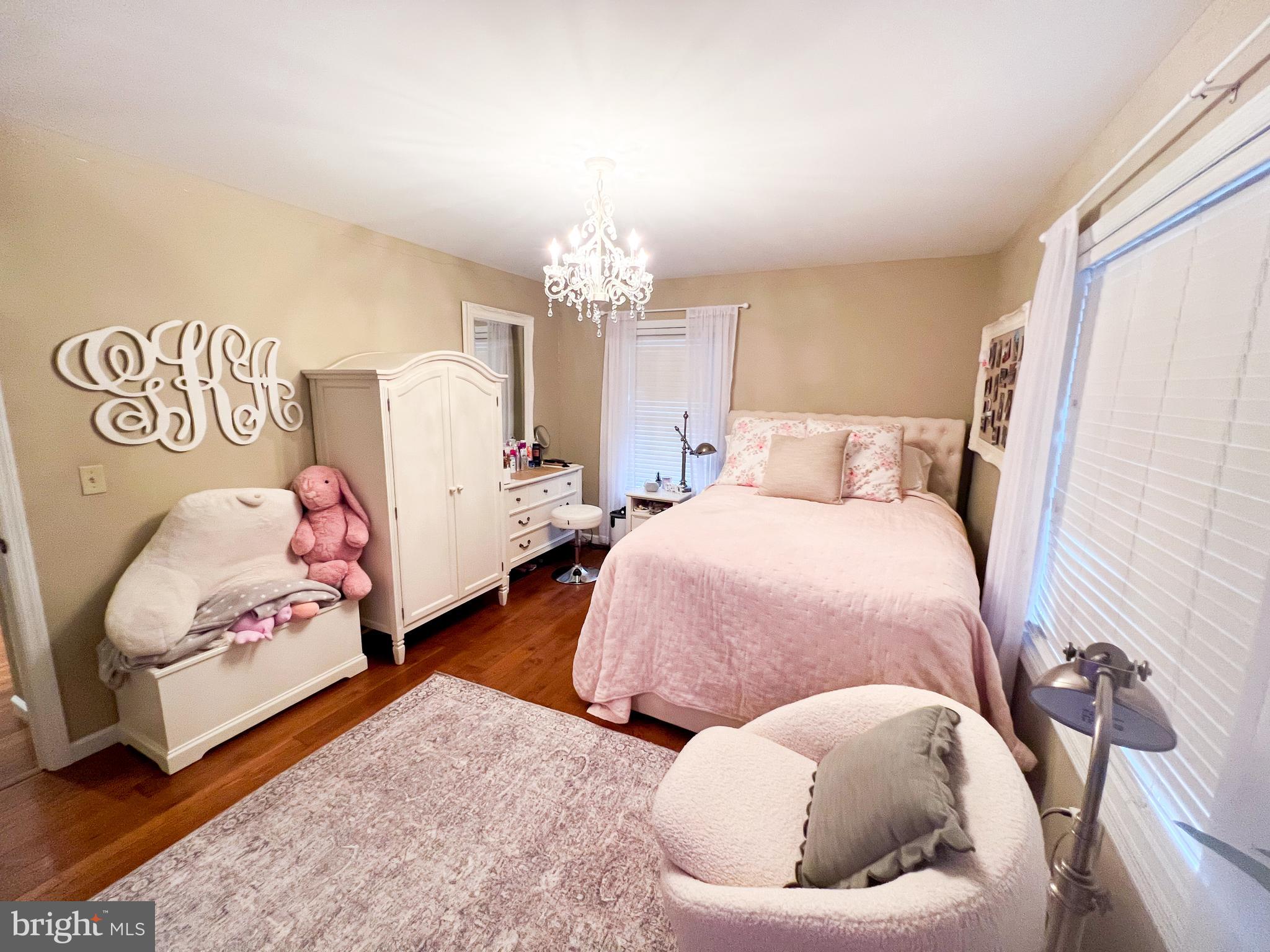 27 Copper Lane Reedsville, PA 17084 - Photo 21 of 45 a bedroom with two beds and a chandelier