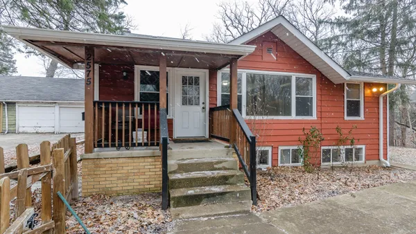 a front view of a house with a porch
