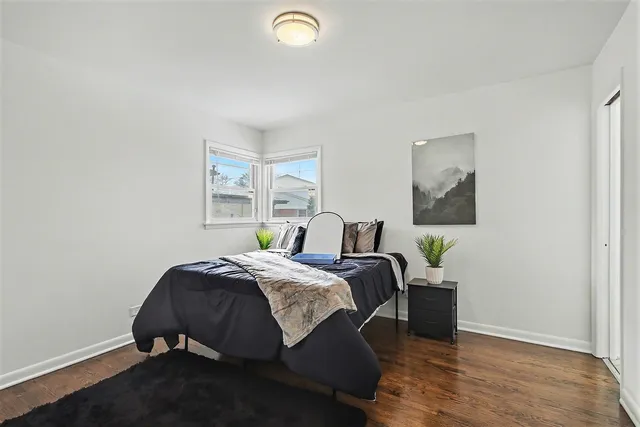 a bed room with a bed and a window