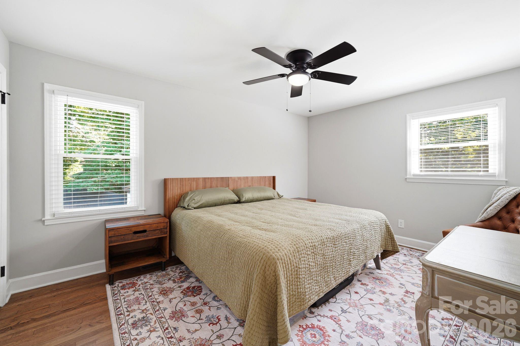 7552 Idlewild Road Charlotte, NC 28212 - Photo 9 of 40 a bedroom with a bed and a window