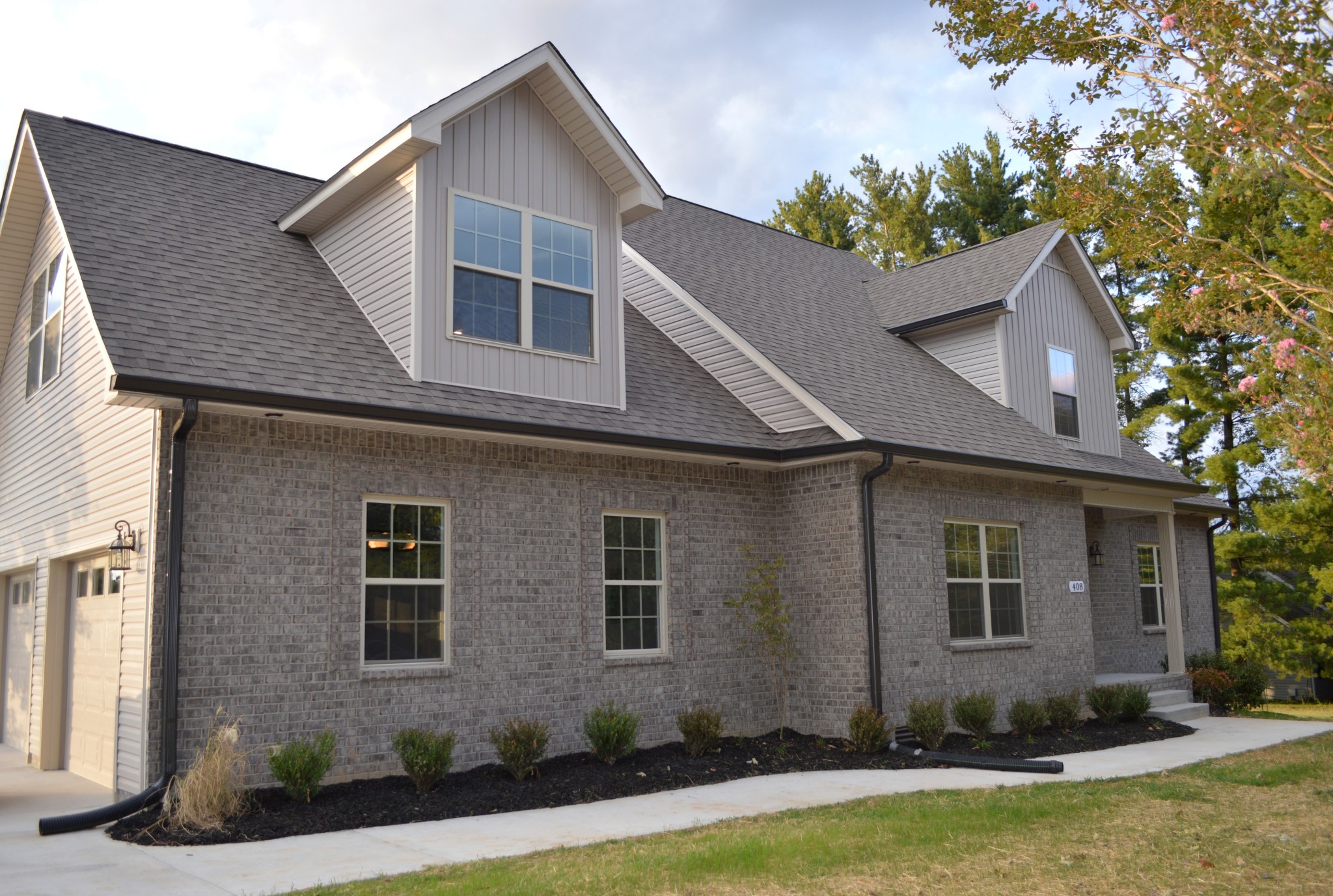 408 Excell Road Clarksville, TN 37043 - Photo 1 of 25 a front view of a house with a yard and garage
