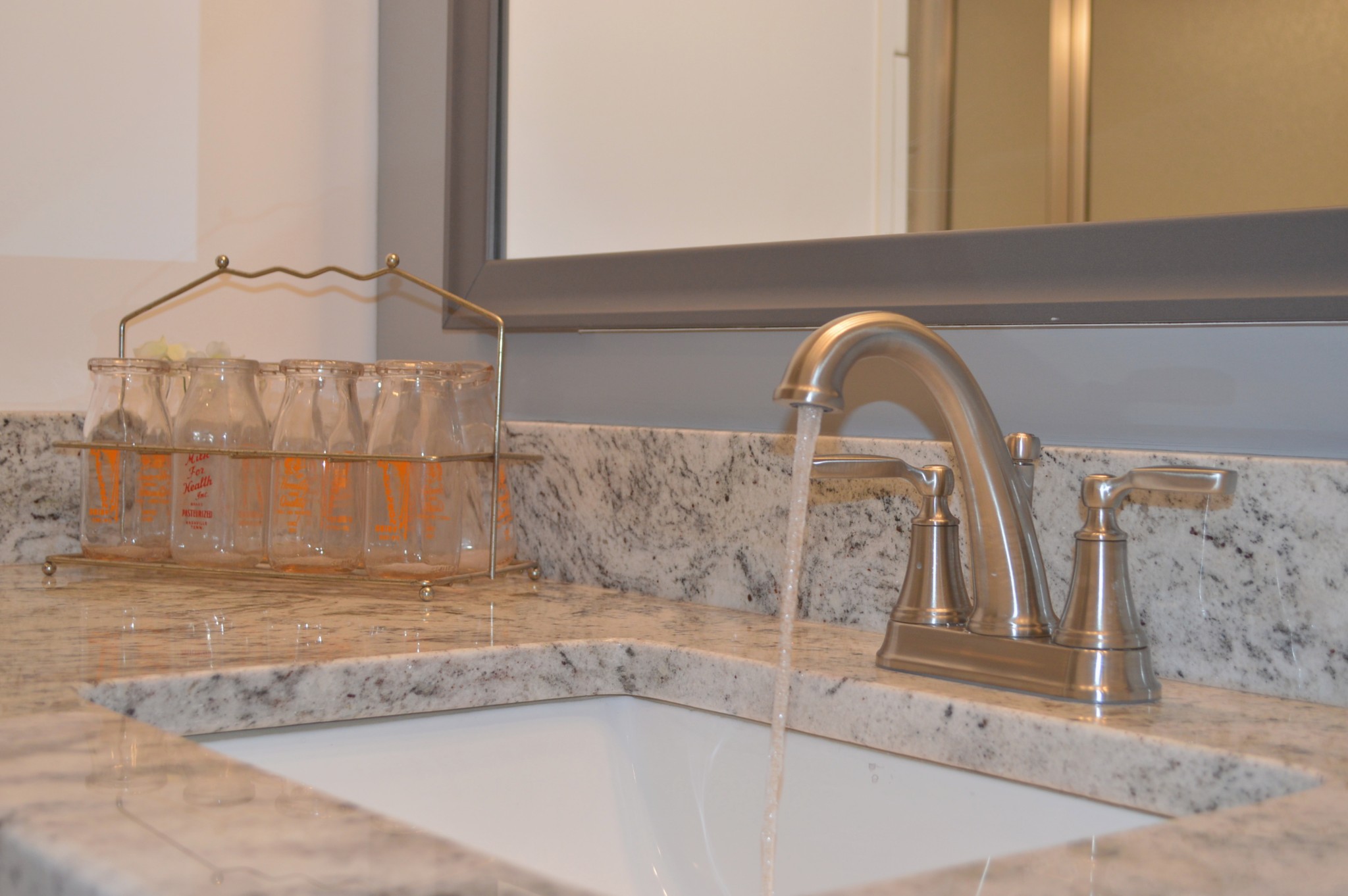 408 Excell Road Clarksville, TN 37043 - Photo 14 of 25 a close view of a faucet a sink and a mirror gate