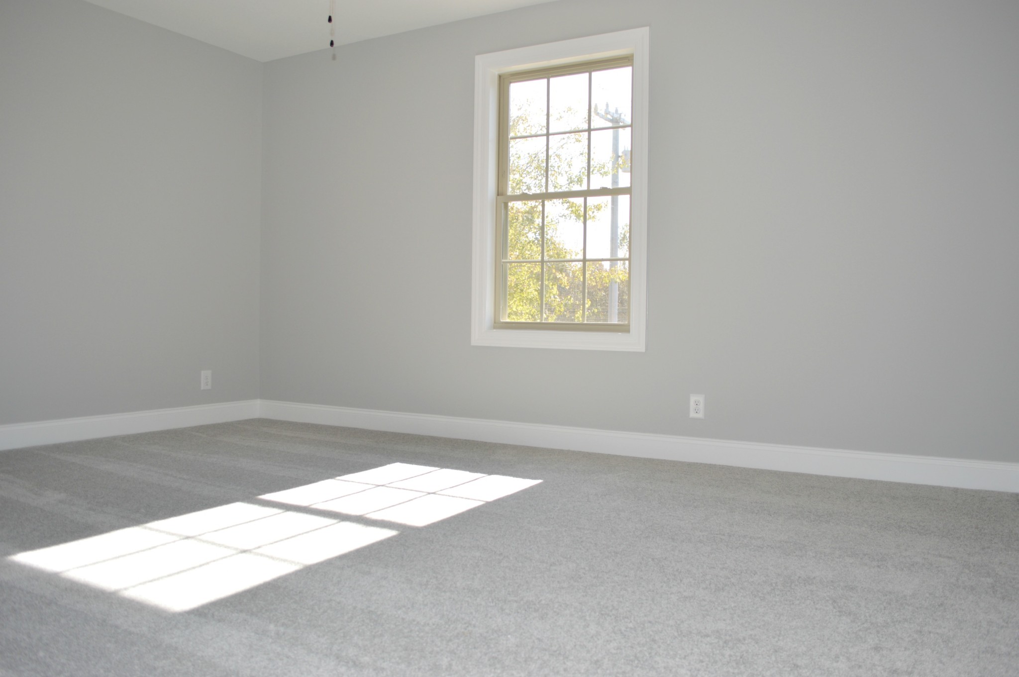 408 Excell Road Clarksville, TN 37043 - Photo 20 of 25 an empty room with wooden floor and windows