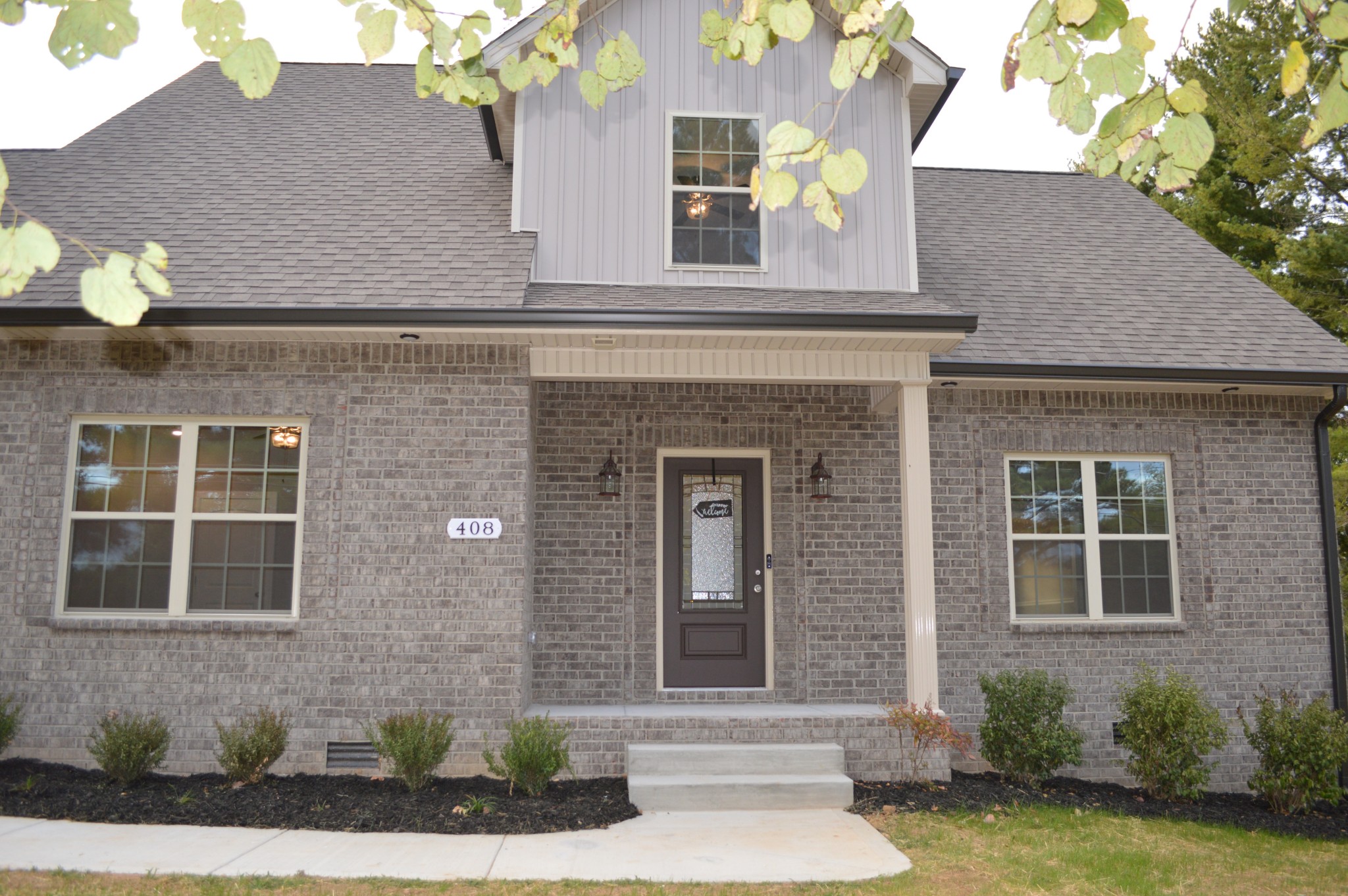 408 Excell Road Clarksville, TN 37043 - Photo 3 of 25 a front view of a house with a yard and garage