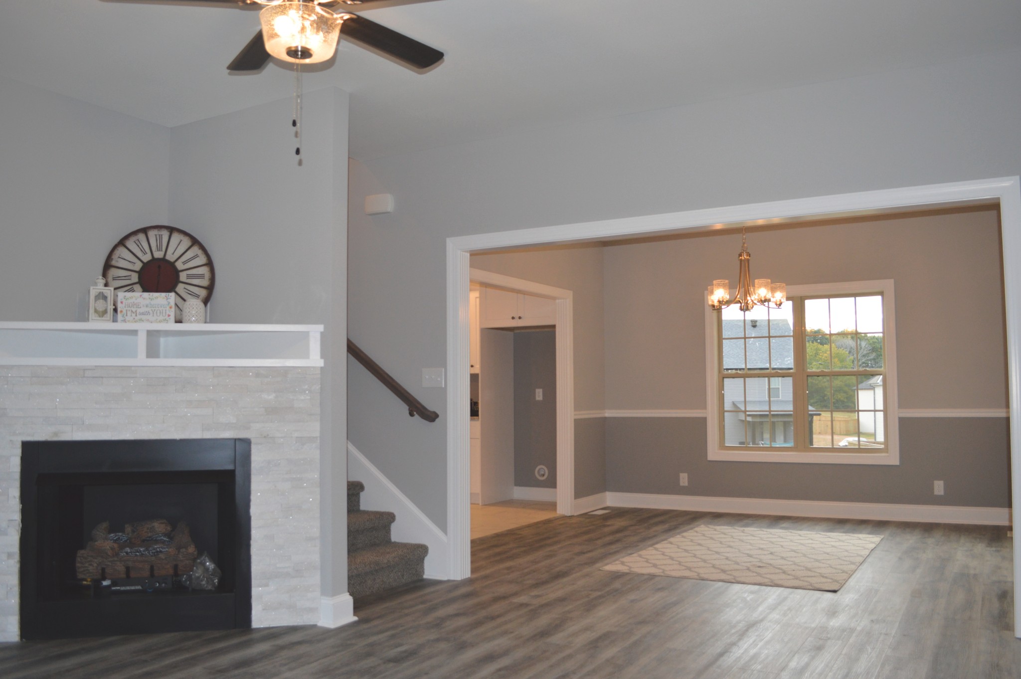 408 Excell Road Clarksville, TN 37043 - Photo 5 of 25 a view of an empty room with wooden floor fireplace and a window