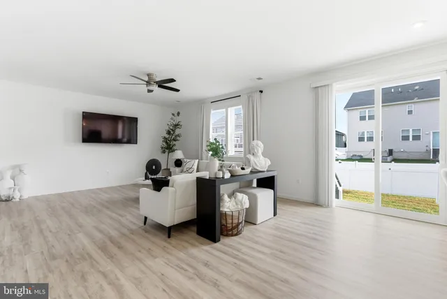 a living room with furniture fireplace and a flat screen tv