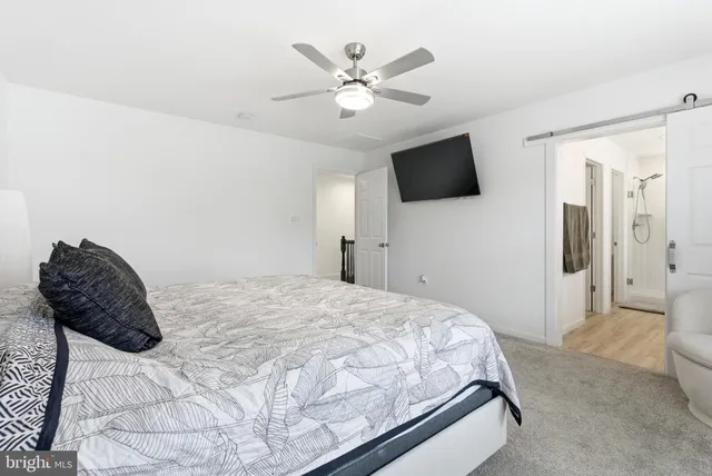 a bathroom with a double vanity sink mirror and shower