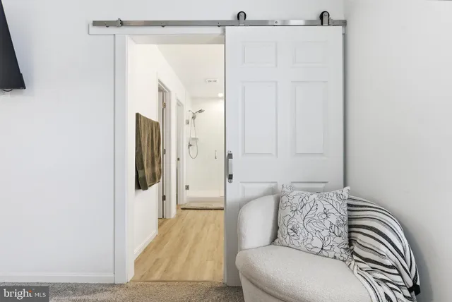 a spacious bathroom with a double vanity sink and a mirror