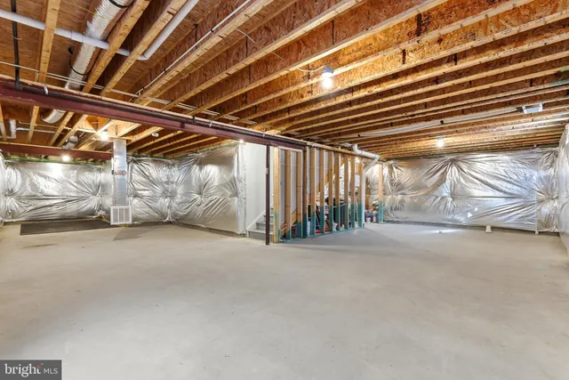 an aerial view of a house with a swimming pool