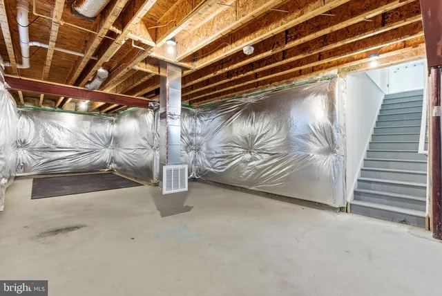an aerial view of residential houses with outdoor space and city view