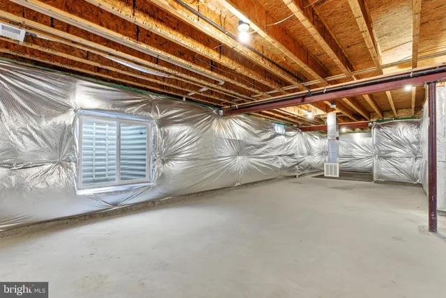 an aerial view of a house with a swimming pool