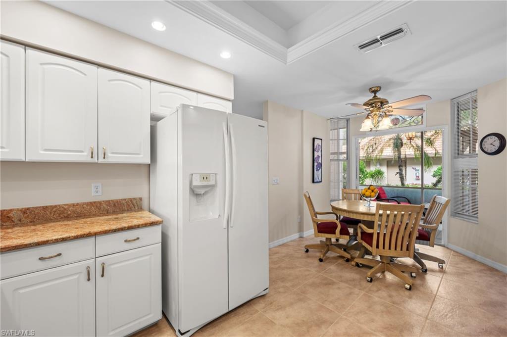 8015 Tiger Cove, Unit 204 Naples, FL 34113 - Photo 13 of 24 a view of a kitchen and dining room