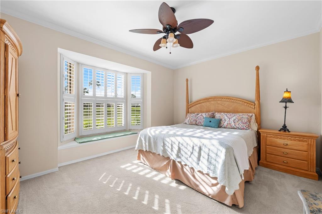 8015 Tiger Cove, Unit 204 Naples, FL 34113 - Photo 15 of 24 a bedroom with a bed and window