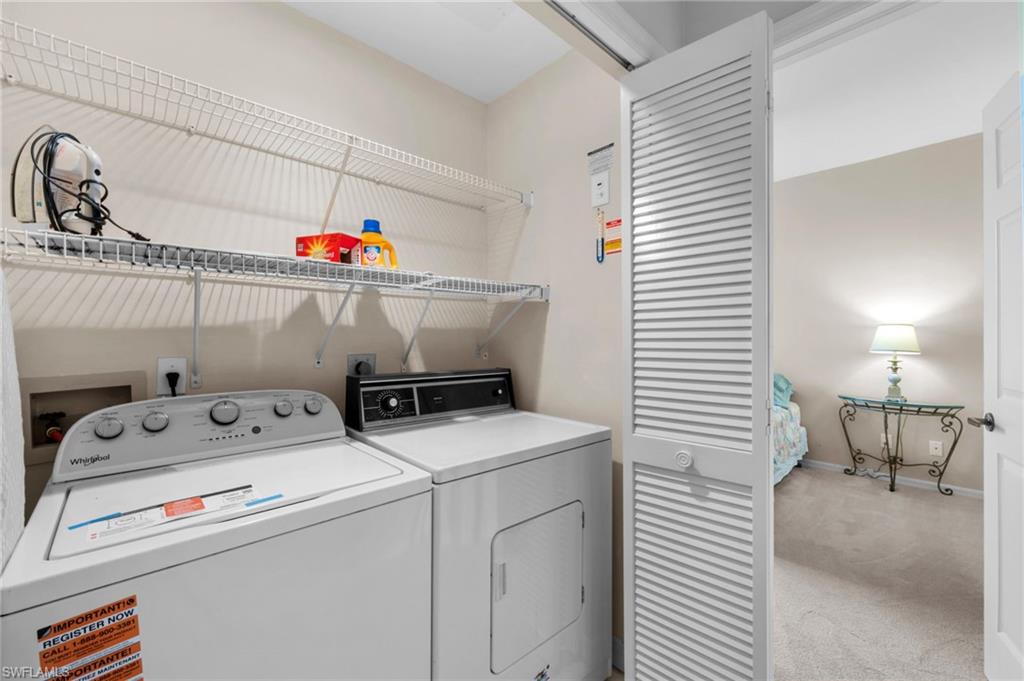 8015 Tiger Cove, Unit 204 Naples, FL 34113 - Photo 23 of 24 a utility room with dryer and washer