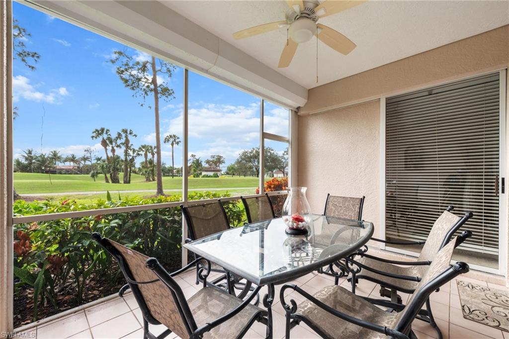 8015 Tiger Cove, Unit 204 Naples, FL 34113 - Photo 24 of 24 a view of an outdoor dining space with furniture and garden view