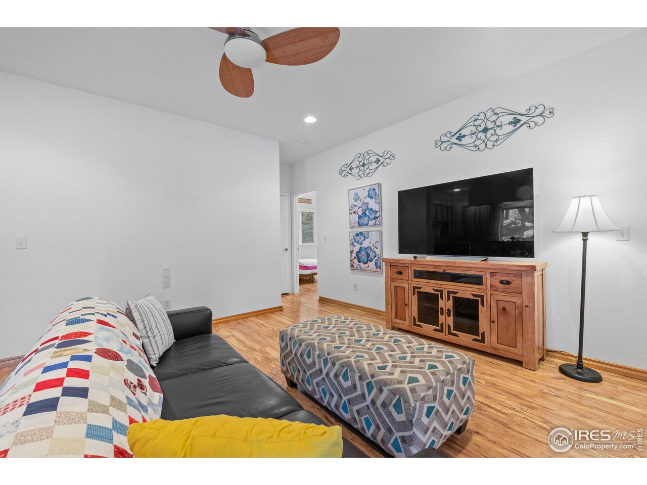 339 Cedar Drive Lyons, CO 80540 - Photo 11 of 37 a living room with furniture and a flat screen tv