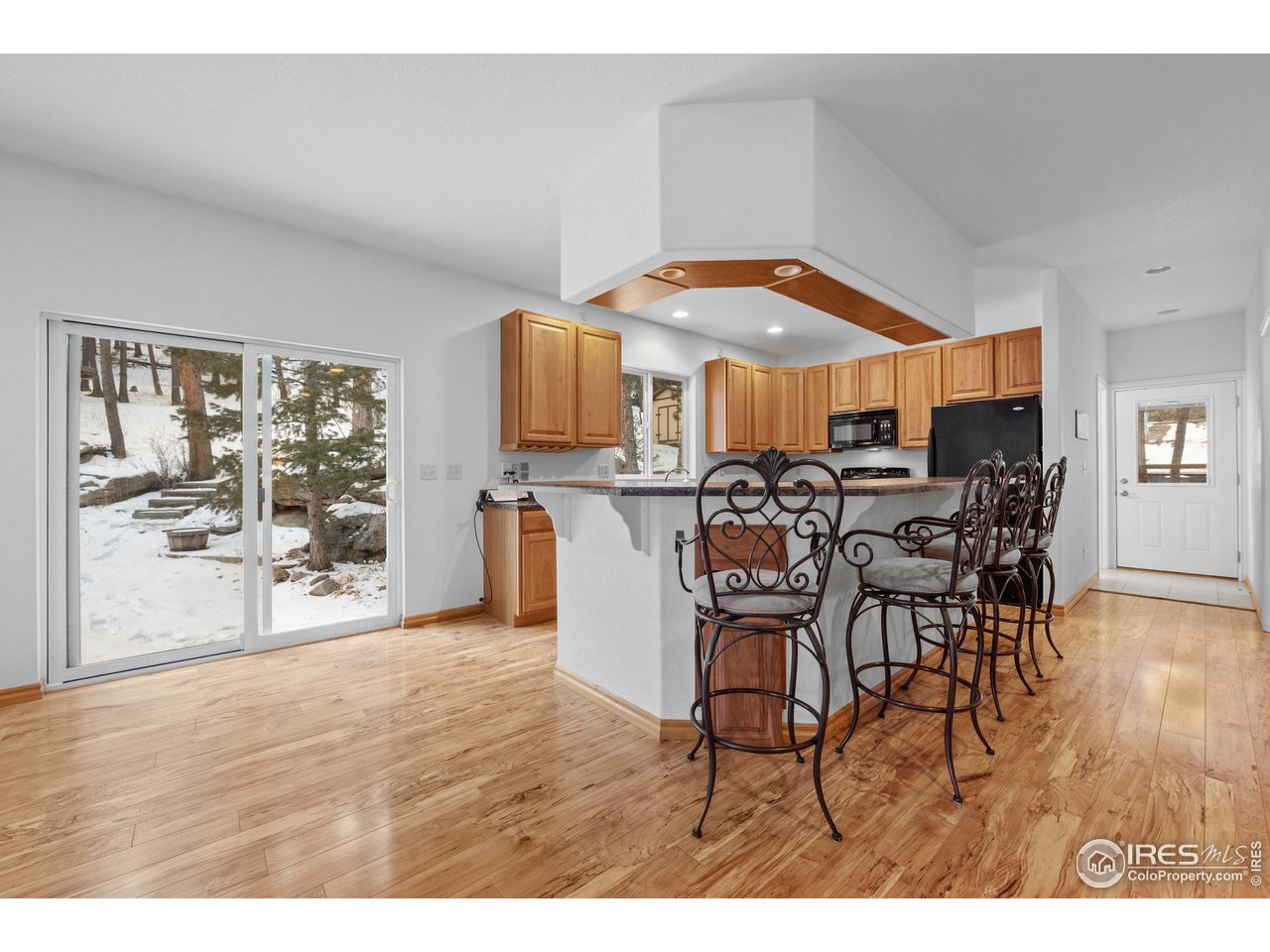 339 Cedar Drive Lyons, CO 80540 - Photo 14 of 37 a dinning table and chairs in a room