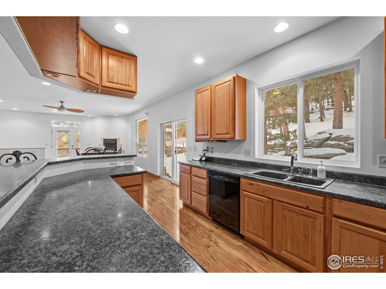 339 Cedar Drive Lyons, CO 80540 - Photo 19 of 37 a kitchen with stainless steel appliances granite countertop a sink and cabinets