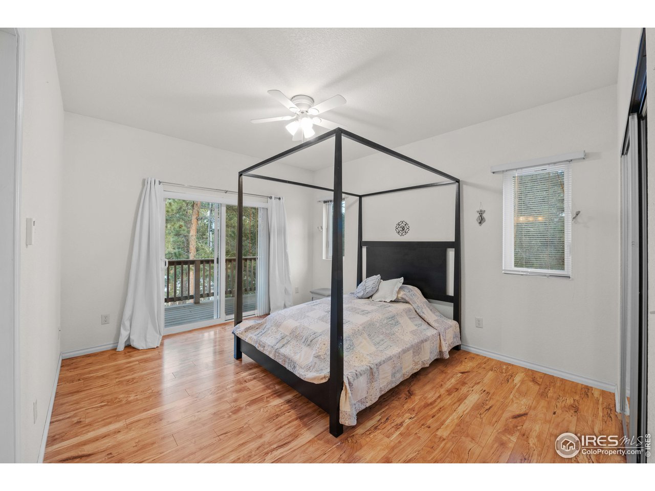 339 Cedar Drive Lyons, CO 80540 - Photo 25 of 37 a bedroom with a bed and a window